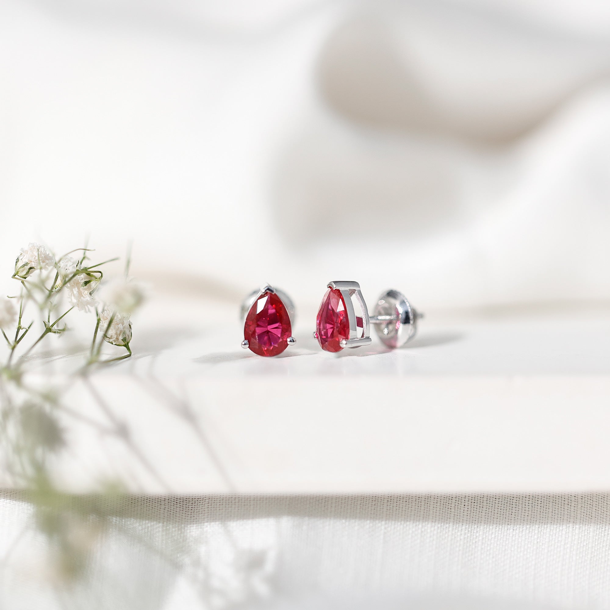Solitaire 1.5 Carat Pear Shaped Lab Created Ruby Stud Earrings AAAA - Rosec Jewels