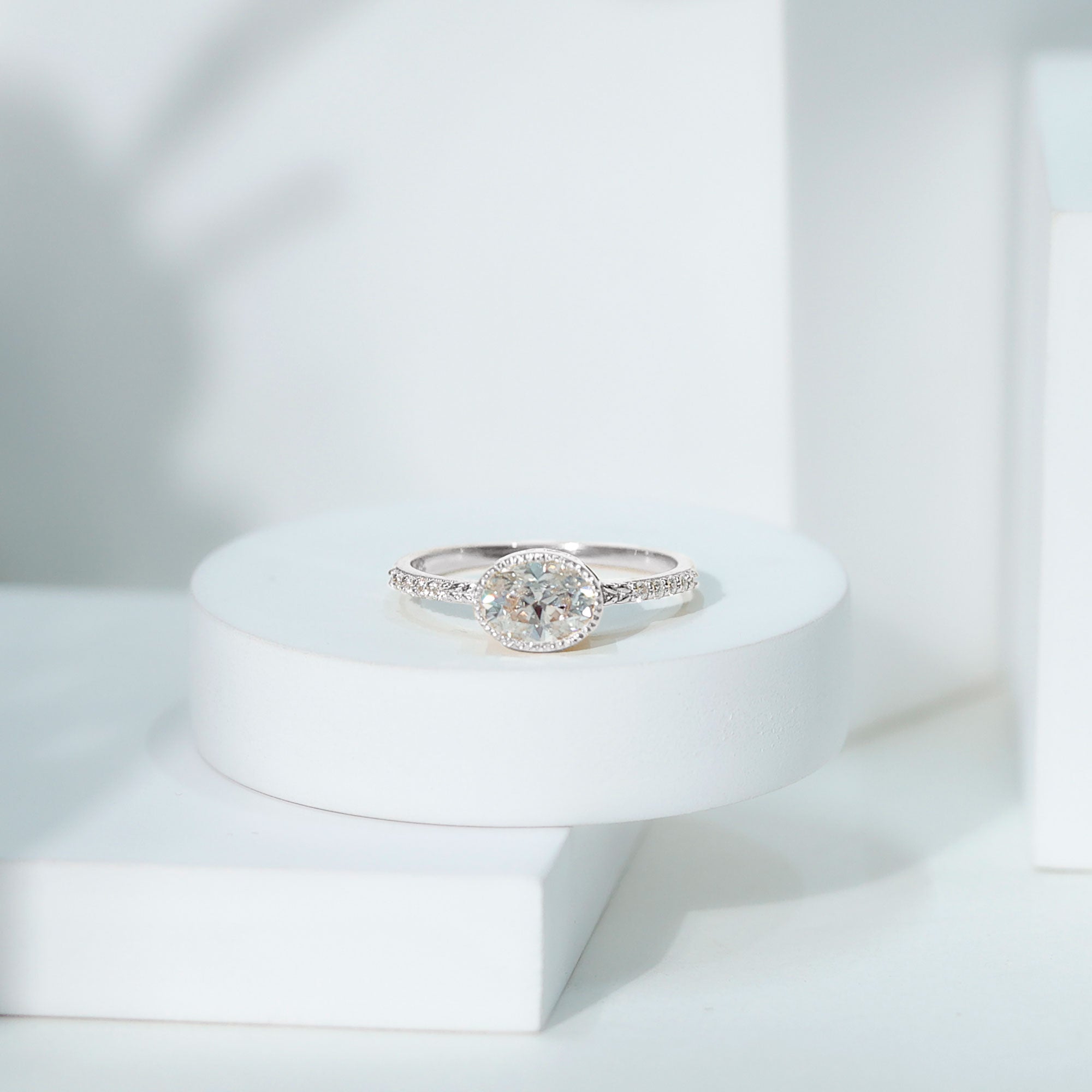 Rosec Jewels-Moissanite East West Engagement Ring in Bezel Setting
