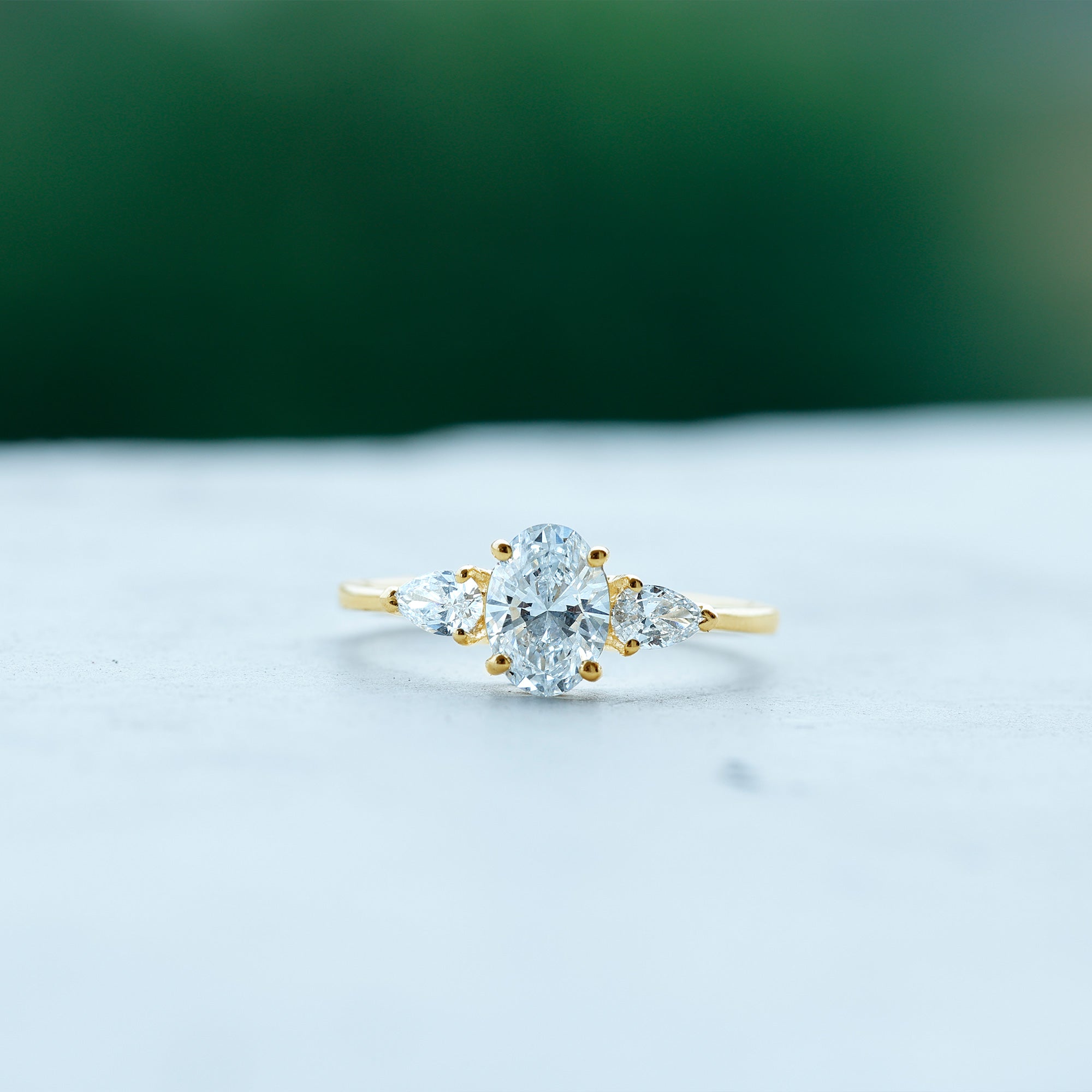 Rosec Jewels-Oval and Pear Cut Moissanite Three Stone Engagement Ring