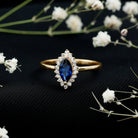 Rosec Jewels-Marquise Cut Lab Grown Blue Sapphire and Diamond Halo Engagement Ring