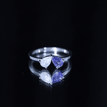 Rosec Jewels-Pear Shaped Tanzanite Moissanite Two Stone Promise Ring in Silver