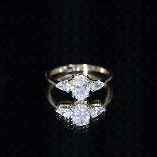 Rosec Jewels-Oval and Pear Cut Moissanite Three Stone Engagement Ring