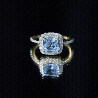 Rosec Jewels-Cushion Cut Sky Blue Topaz and Diamond Halo Engagement Ring
