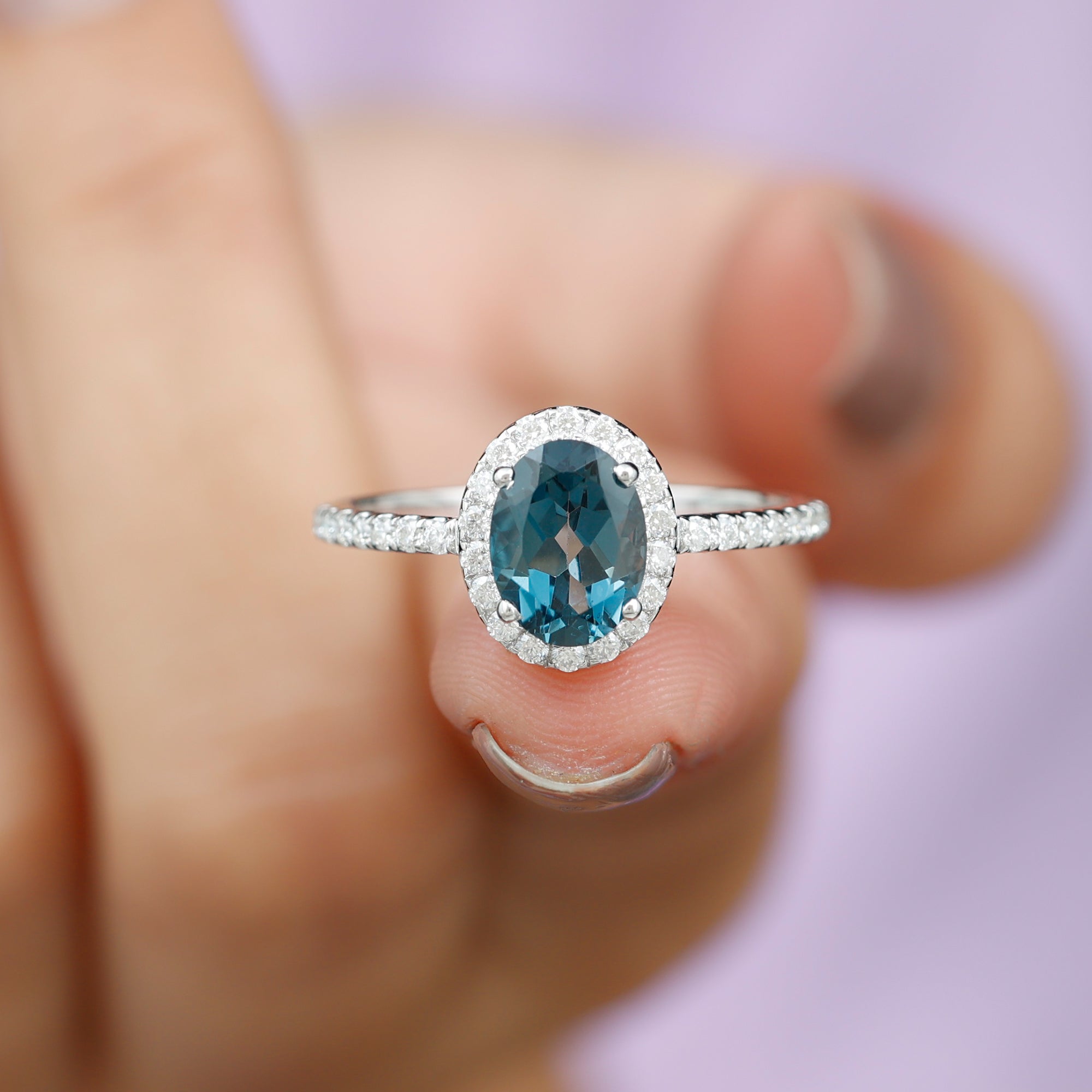 Diamond ring with blue topaz side stones outlet